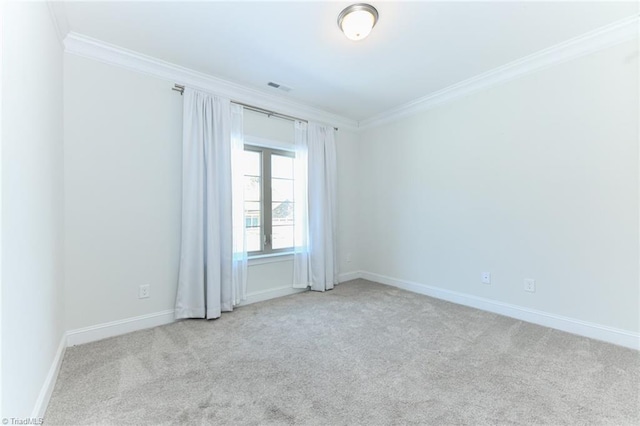 carpeted spare room with ornamental molding