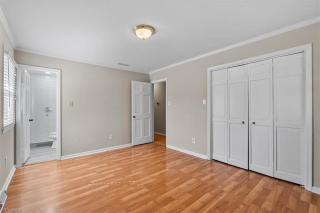 unfurnished bedroom with crown molding, baseboards, visible vents, and light wood-type flooring