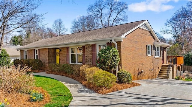 view of front of home featuring brick siding