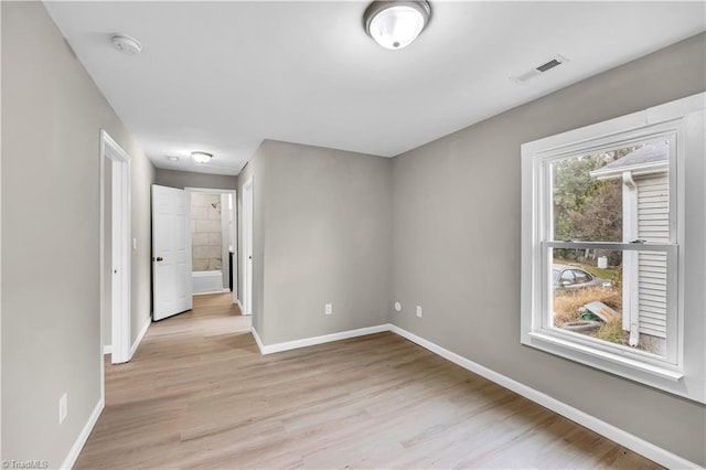 empty room with light wood-type flooring