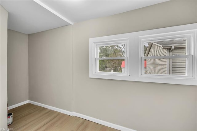 spare room featuring light wood-type flooring