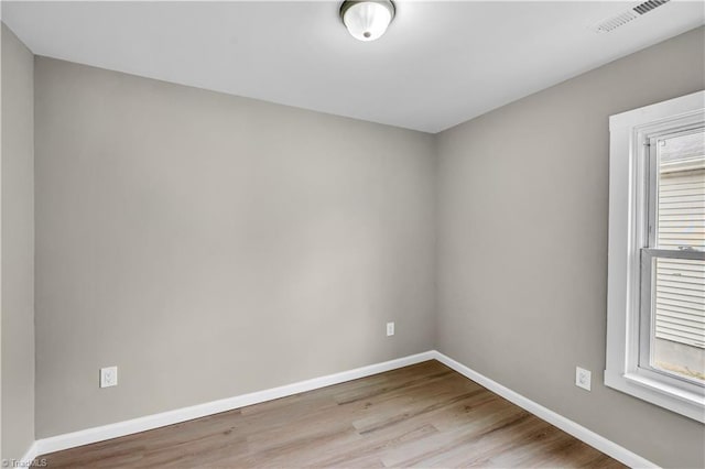 empty room with light wood-type flooring