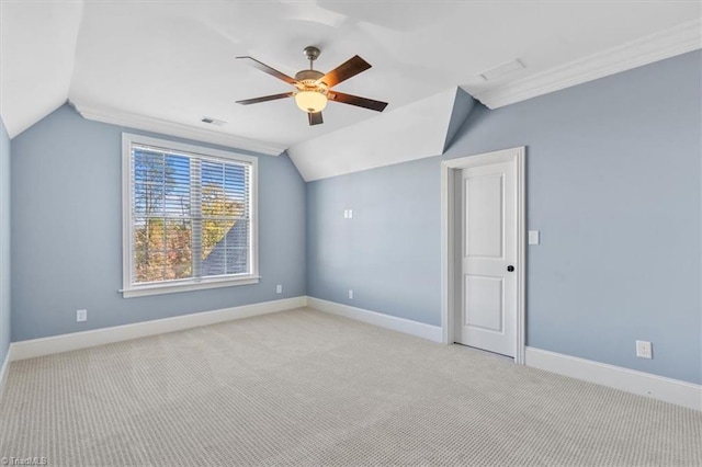 additional living space with ceiling fan, light colored carpet, and lofted ceiling