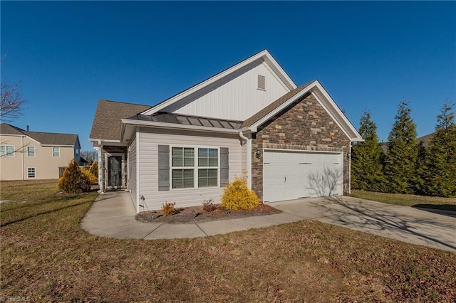 view of front of property featuring a garage and a front lawn