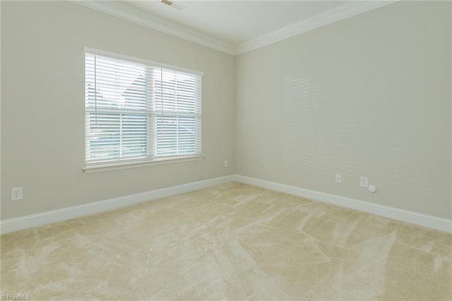 carpeted spare room with crown molding