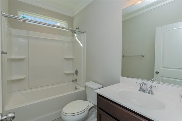 full bathroom featuring ornamental molding, bathing tub / shower combination, vanity, and toilet