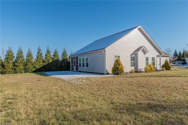 view of home's exterior featuring a lawn