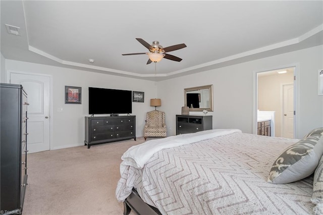 bedroom with visible vents, baseboards, light colored carpet, a raised ceiling, and a ceiling fan