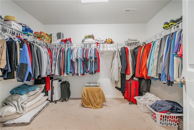 walk in closet with carpet and visible vents