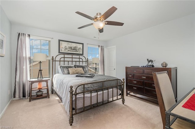 bedroom featuring a ceiling fan, carpet, and baseboards