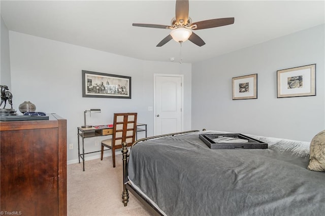 bedroom with light colored carpet, a ceiling fan, and baseboards