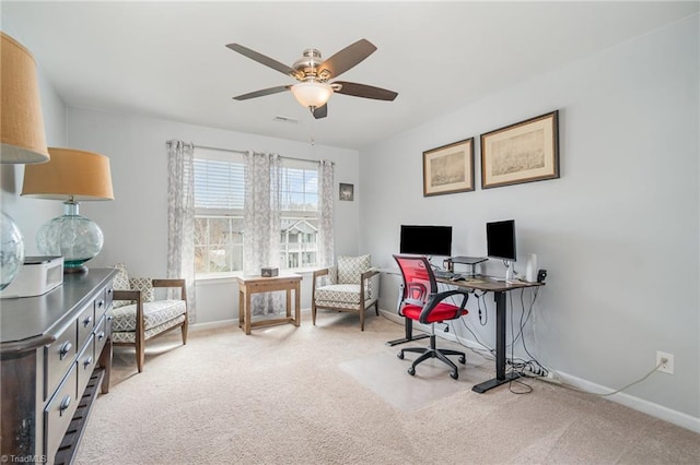 home office with visible vents, carpet floors, baseboards, and a ceiling fan