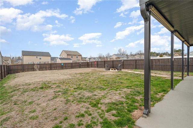 view of yard featuring a residential view and a fenced backyard