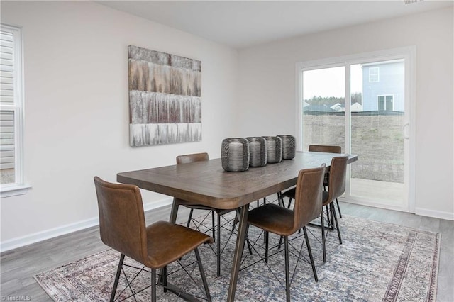 dining area featuring hardwood / wood-style flooring