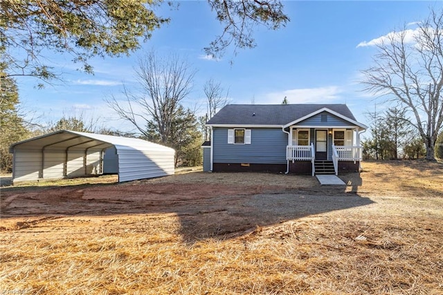 view of front of house with a porch and a carport