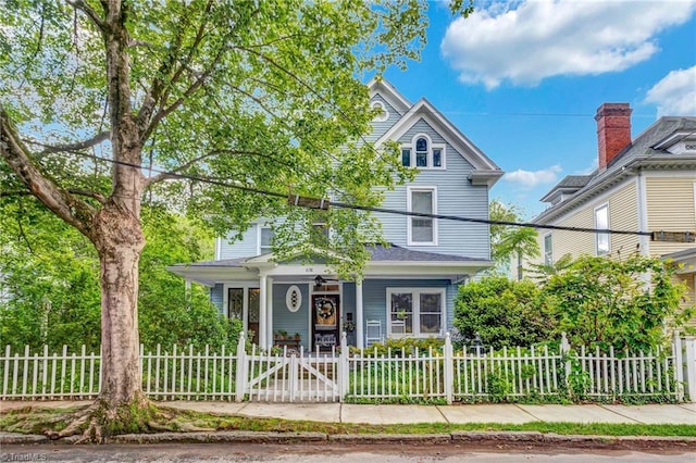 638 N Spring St, Winston-Salem, NC 27101 - view of front of house featuring covered porch, a fenced front yard, and a gate