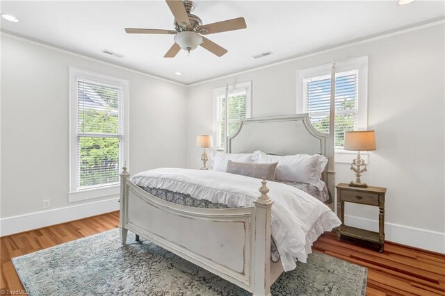 638 N Spring St, Winston-Salem, NC 27101 - bedroom with crown molding, light wood finished floors, baseboards, recessed lighting, and a ceiling fan