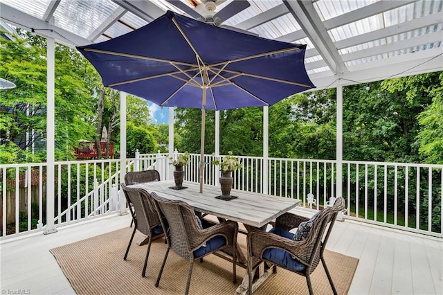 638 N Spring St, Winston-Salem, NC 27101 - wooden terrace featuring outdoor dining area, view of wooded area, and a pergola