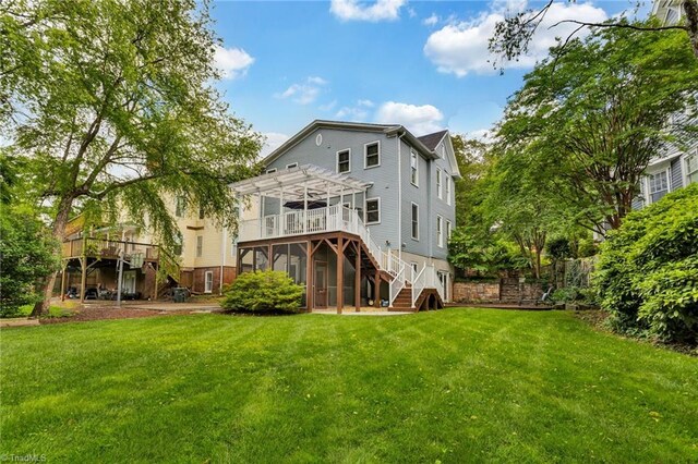638 N Spring St, Winston-Salem, NC 27101 - back of property featuring stairs, a pergola, a wooden deck, and a yard