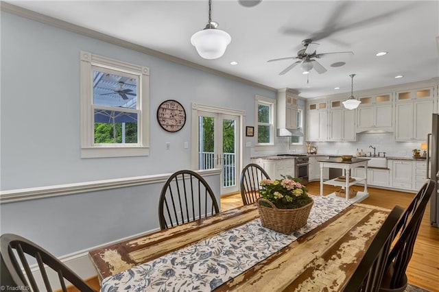 638 N Spring St, Winston-Salem, NC 27101 - dining area with plenty of natural light, ceiling fan, crown molding, light wood-style floors, and recessed lighting