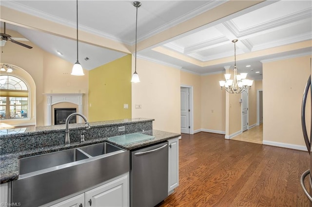 kitchen with decorative light fixtures, white cabinetry, dishwasher, dark stone countertops, and ornamental molding