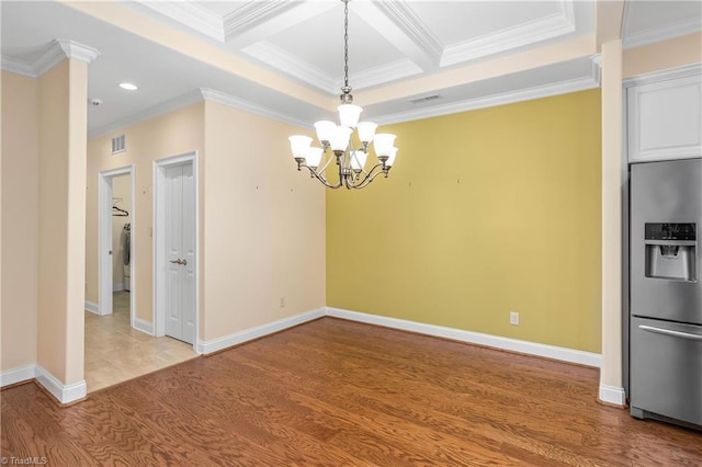 unfurnished dining area with coffered ceiling, light wood-type flooring, crown molding, beamed ceiling, and an inviting chandelier