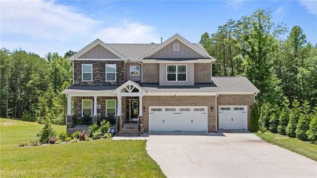 2590 Mccullum Ct, Browns Summit, NC 27214 - craftsman inspired home with driveway, a front yard, board and batten siding, a porch, and an attached garage