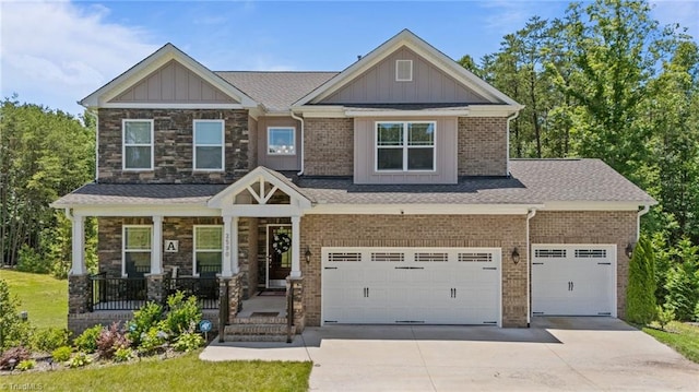 2590 Mccullum Ct, Browns Summit, NC 27214 - craftsman house with driveway, covered porch, a garage, and board and batten siding