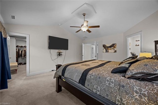 2590 Mccullum Ct, Browns Summit, NC 27214 - carpeted bedroom with lofted ceiling, a walk in closet, a closet, and a ceiling fan