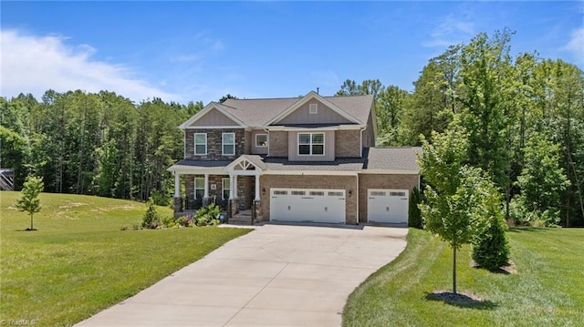 2590 Mccullum Ct, Browns Summit, NC 27214 - craftsman-style home featuring driveway, a front lawn, board and batten siding, and a garage