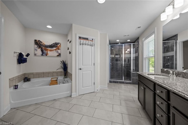 2590 Mccullum Ct, Browns Summit, NC 27214 - full bathroom with vanity, a stall shower, a bath, tile patterned floors, and recessed lighting