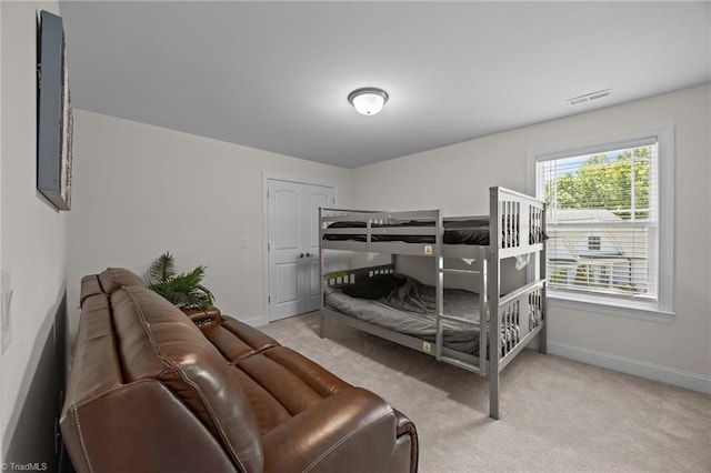 2590 Mccullum Ct, Browns Summit, NC 27214 - bedroom featuring baseboards and light carpet