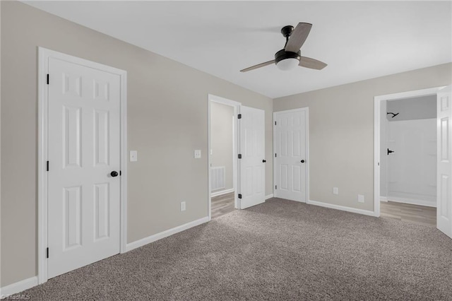 unfurnished bedroom featuring ceiling fan, connected bathroom, and carpet flooring