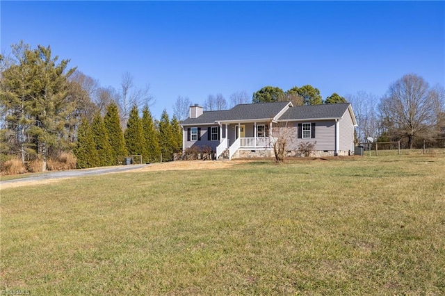 view of front of house with covered porch and a front lawn