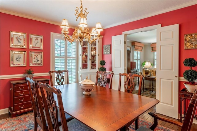 298 Duke Dr, Lexington, NC 27292 - dining area featuring a chandelier, ornamental molding, and wood finished floors