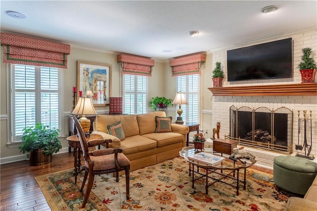 298 Duke Dr, Lexington, NC 27292 - living area featuring crown molding, hardwood / wood-style floors, and a brick fireplace