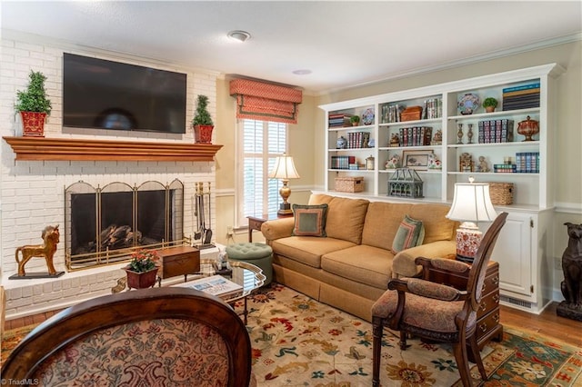 298 Duke Dr, Lexington, NC 27292 - living area featuring ornamental molding, a brick fireplace, and wood finished floors