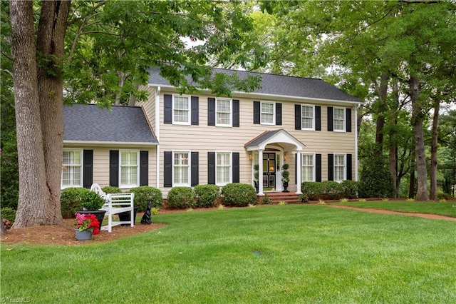 298 Duke Dr, Lexington, NC 27292 - colonial house featuring a front yard and a shingled roof