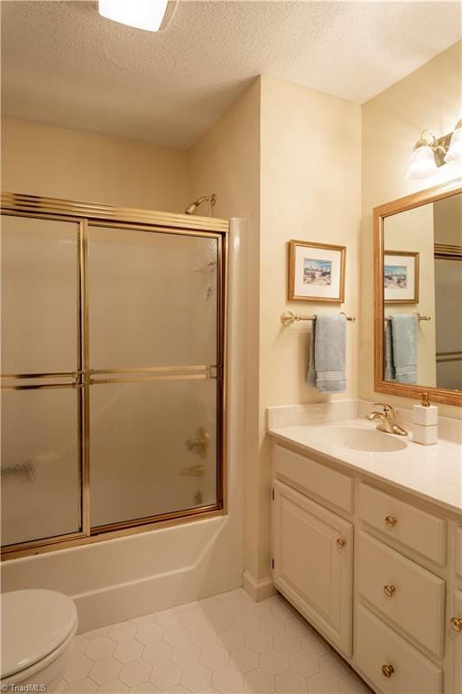 298 Duke Dr, Lexington, NC 27292 - full bathroom with vanity, a textured ceiling, toilet, combined bath / shower with glass door, and tile patterned flooring