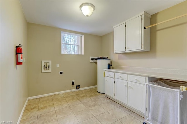 laundry area featuring cabinets, light tile patterned floors, washer hookup, and hookup for an electric dryer