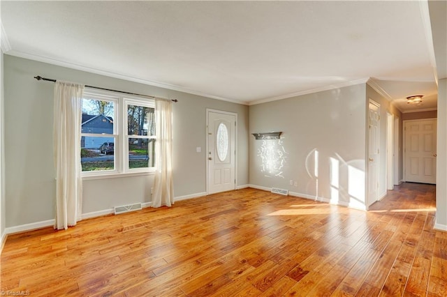 foyer entrance with light wood-type flooring and ornamental molding