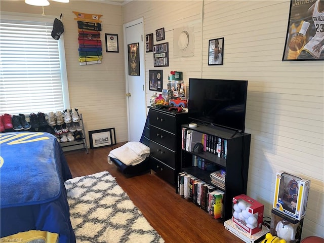 bedroom with dark hardwood / wood-style floors