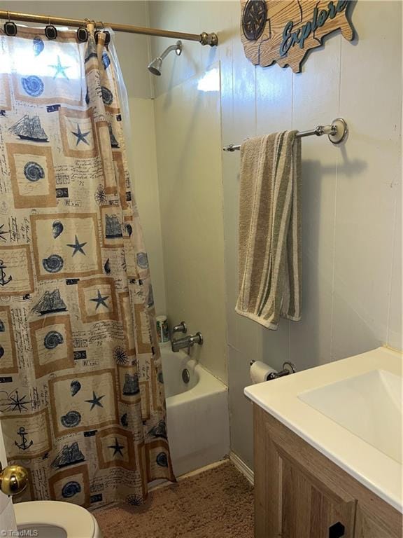 full bathroom featuring vanity, shower / tub combo, and toilet