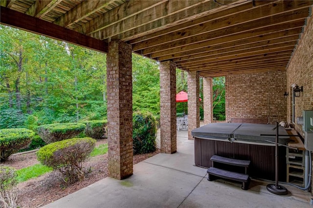 view of patio with a hot tub