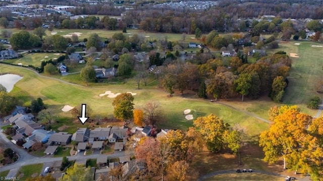 birds eye view of property with a residential view and golf course view