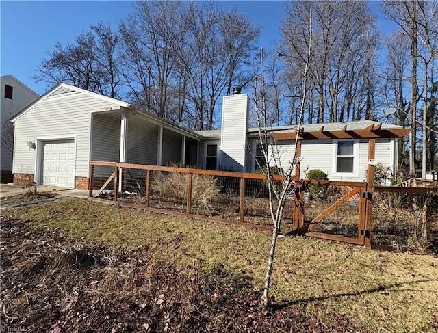 back of property featuring a garage