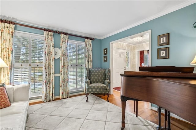 sitting room featuring ornamental molding, light hardwood / wood-style flooring, and a healthy amount of sunlight