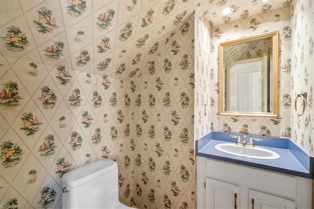 bathroom with vanity and toilet