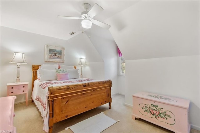 carpeted bedroom featuring ceiling fan and vaulted ceiling