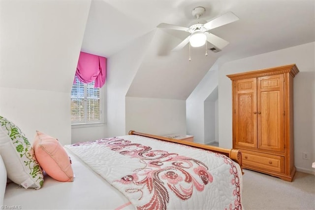 bedroom with ceiling fan, light carpet, and lofted ceiling